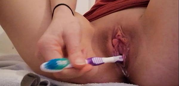  Perfect teen desperately masturbates with a toothbrush